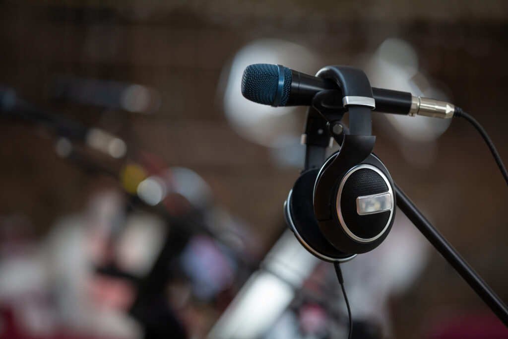 A closeup shot of a headphone on the microphone on a blurred background