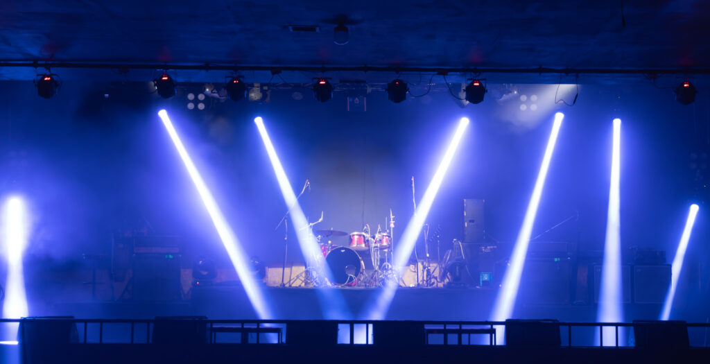 Empty stage concert with colorful lighting laser beam spotlight show in disco pub club bar background for party music dancing festival performance. Entertainment nightlife. Celebration event.