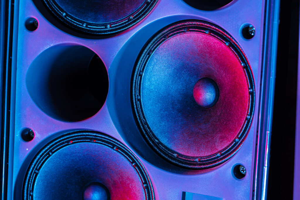 Stereo column of modern audio system close up in the dark